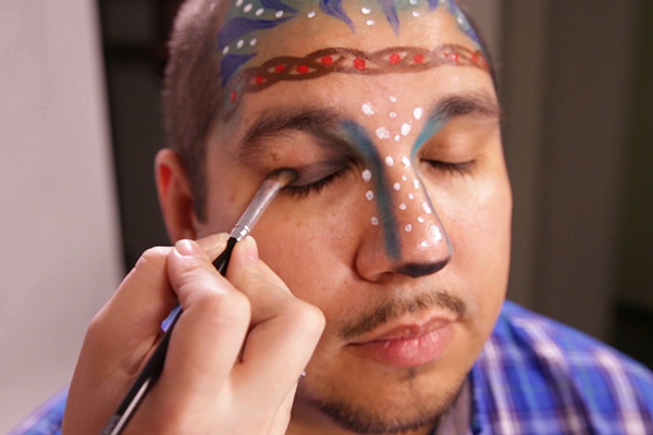 You apply the black base to eyelids, step 11 of the Avatar Face Paint Tutorial.